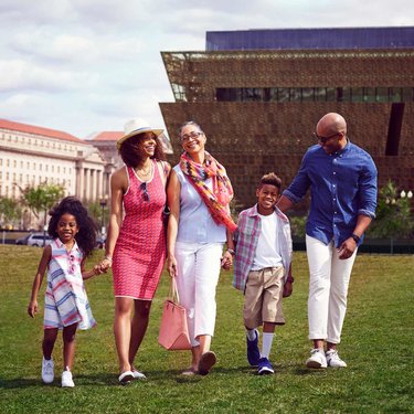 Family in front of Smithsonian NMAAHC Family in front of Smithsonian NMAAHC